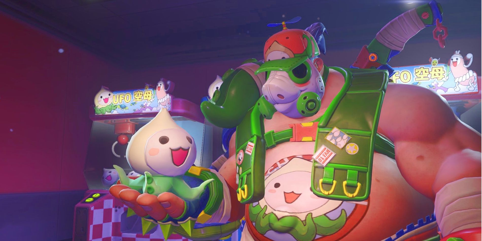 Image shows the Overwatch character Roadhog in his Pachimari skin while holding a large plush of a Pachimari.