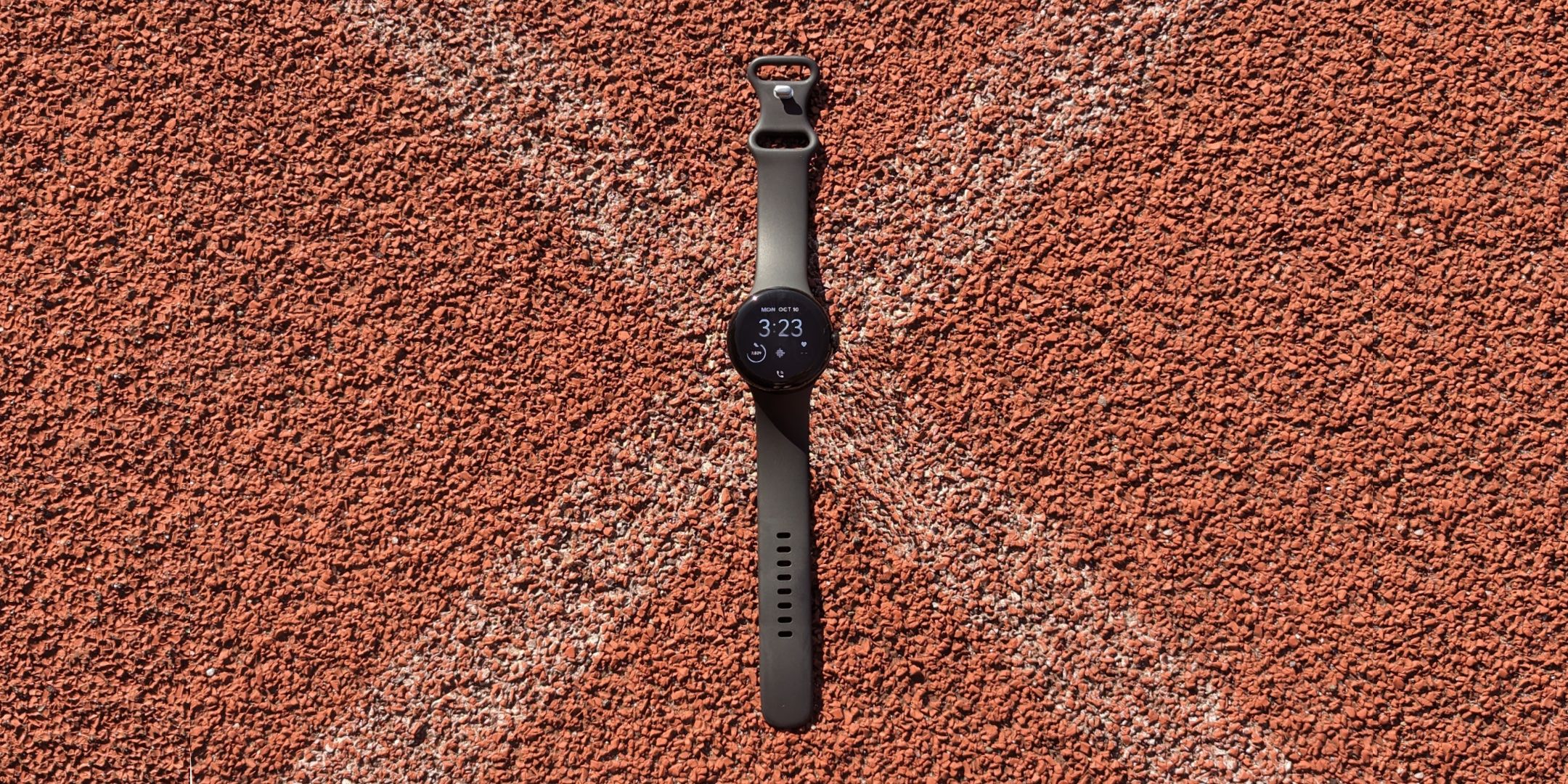 Pixel watch on a running track.