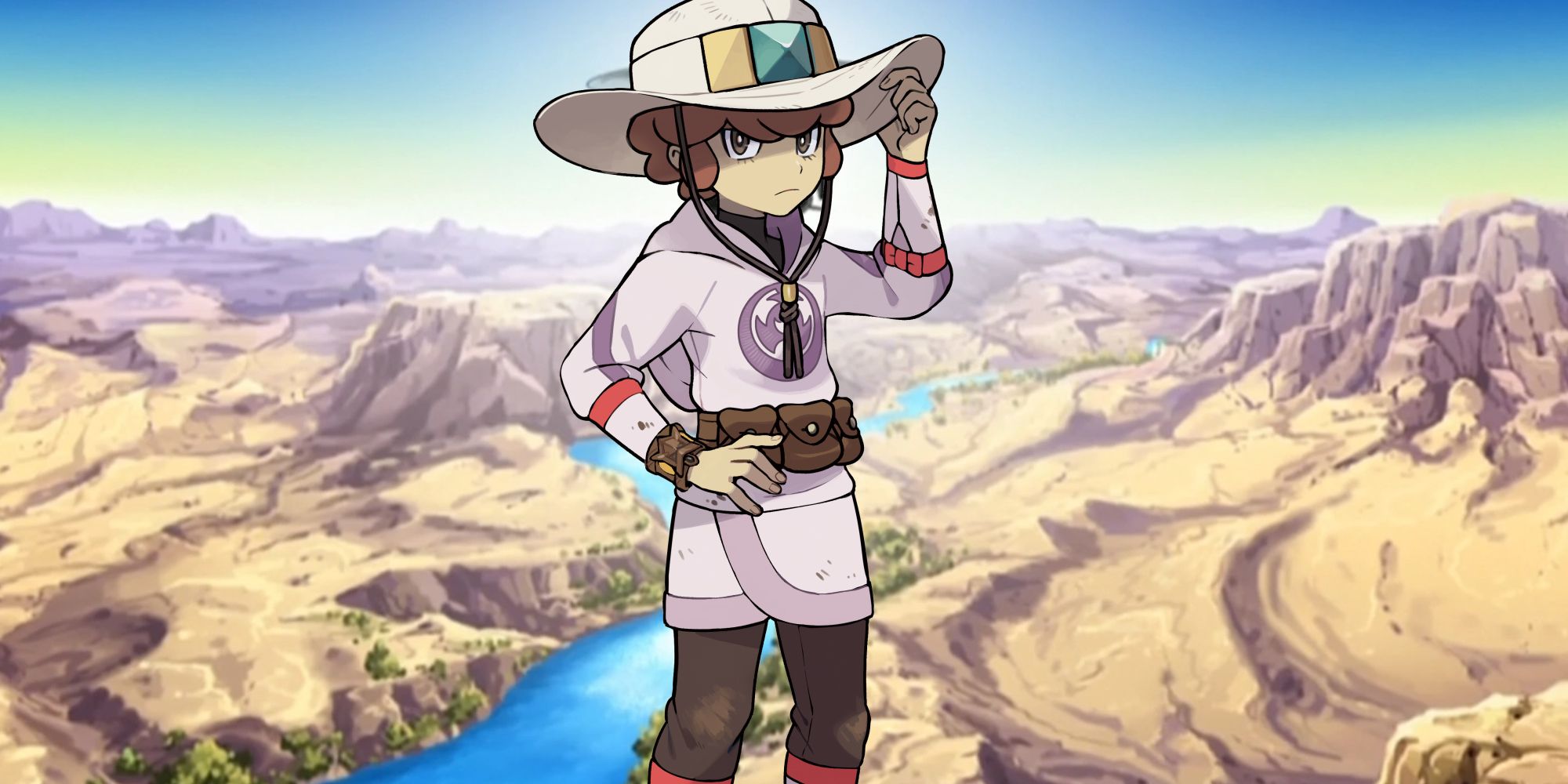 Pokémon's Lian in front of a desert landscape.