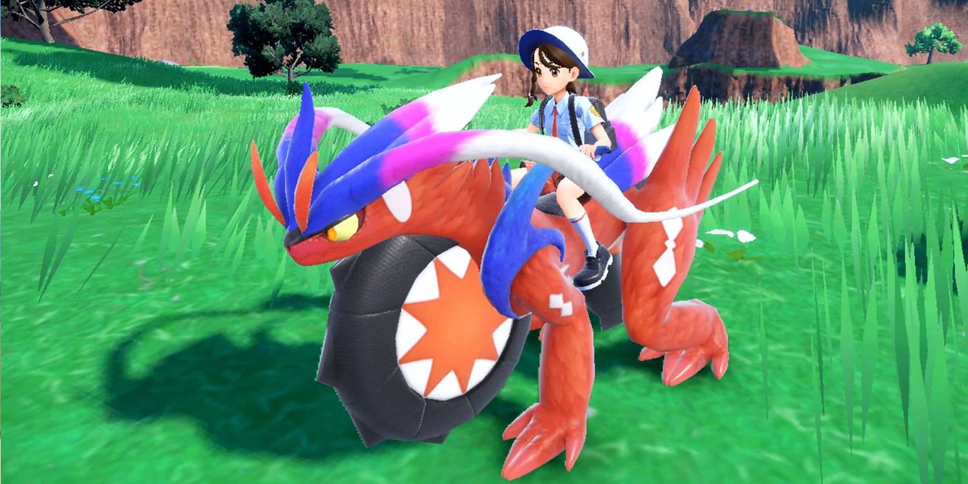 A Pokémon trainer riding on Koraidon, Scarlet's Legendary.