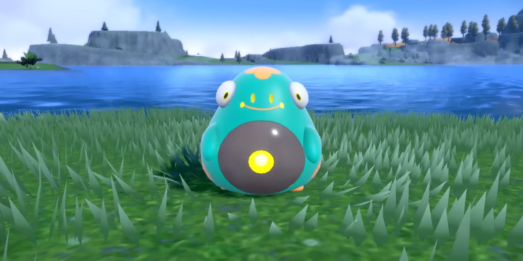 Bellibolt standing on a grassy field with a lake behind it in Pokémon Scarlet and Violet.