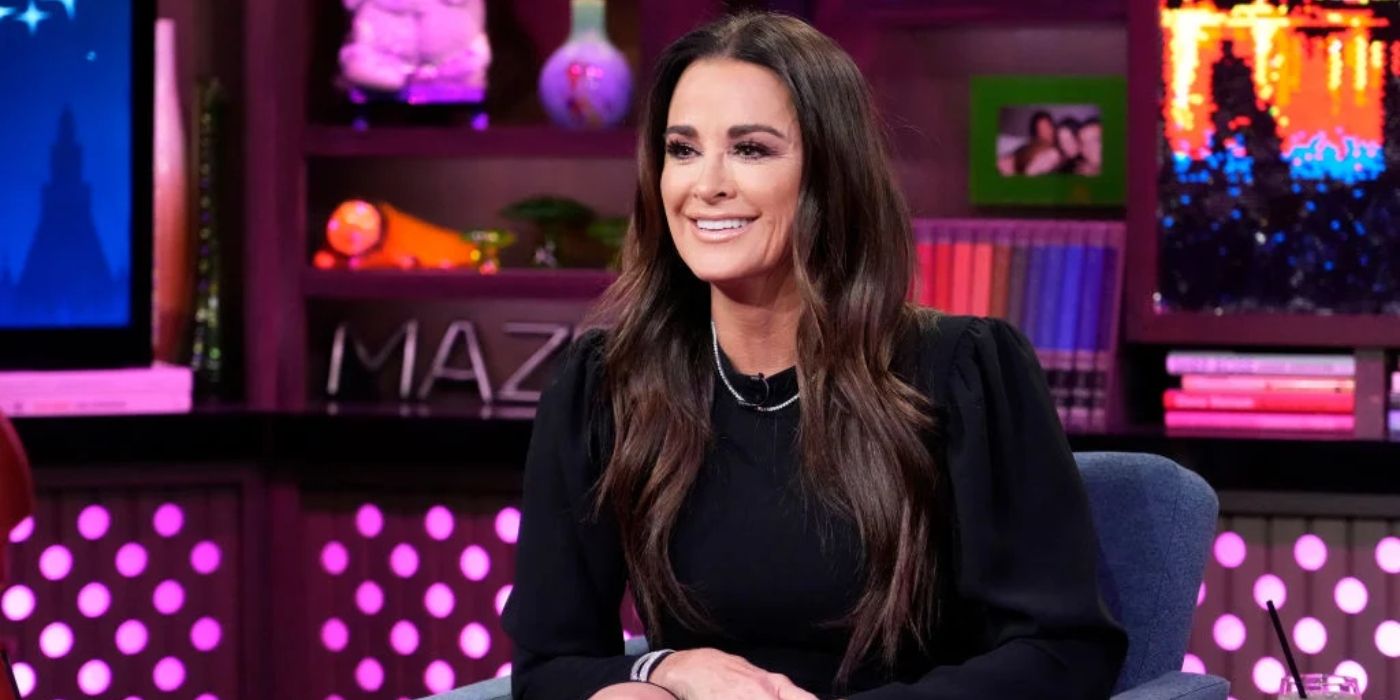 Kyle Richards from RHOBH on WWHL smiling in black top