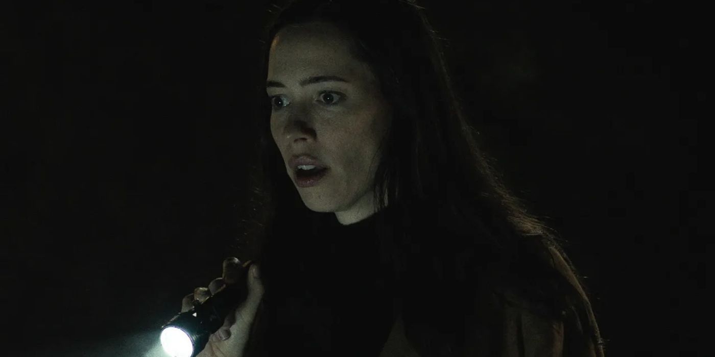 Rebecca Hall In The Night House with a flashlight