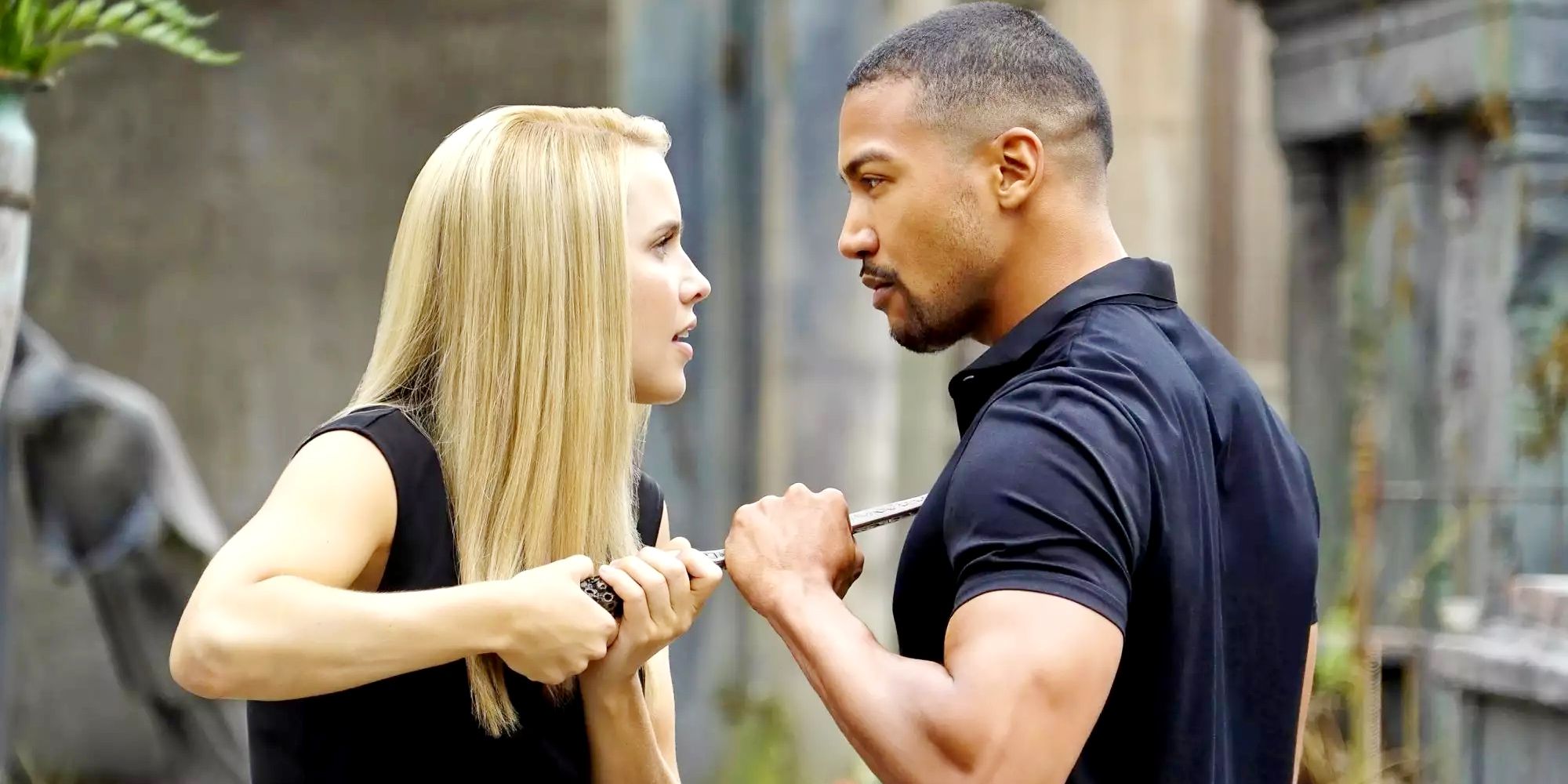 Rebekah and Marcel fighting over a sword on The Originals