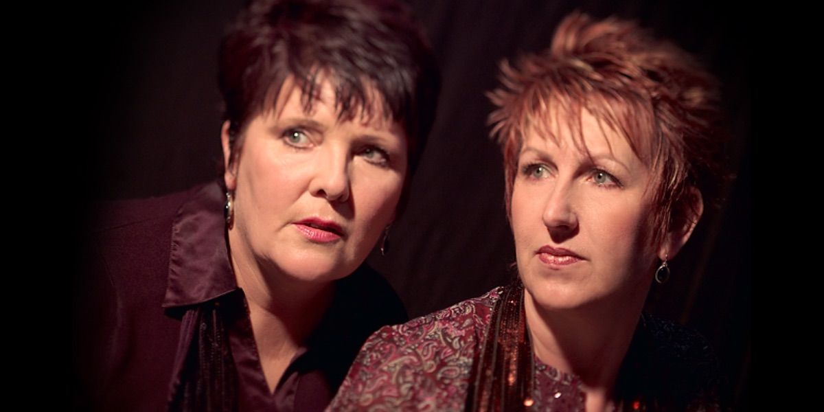 Two women look on in Rescue Mediums