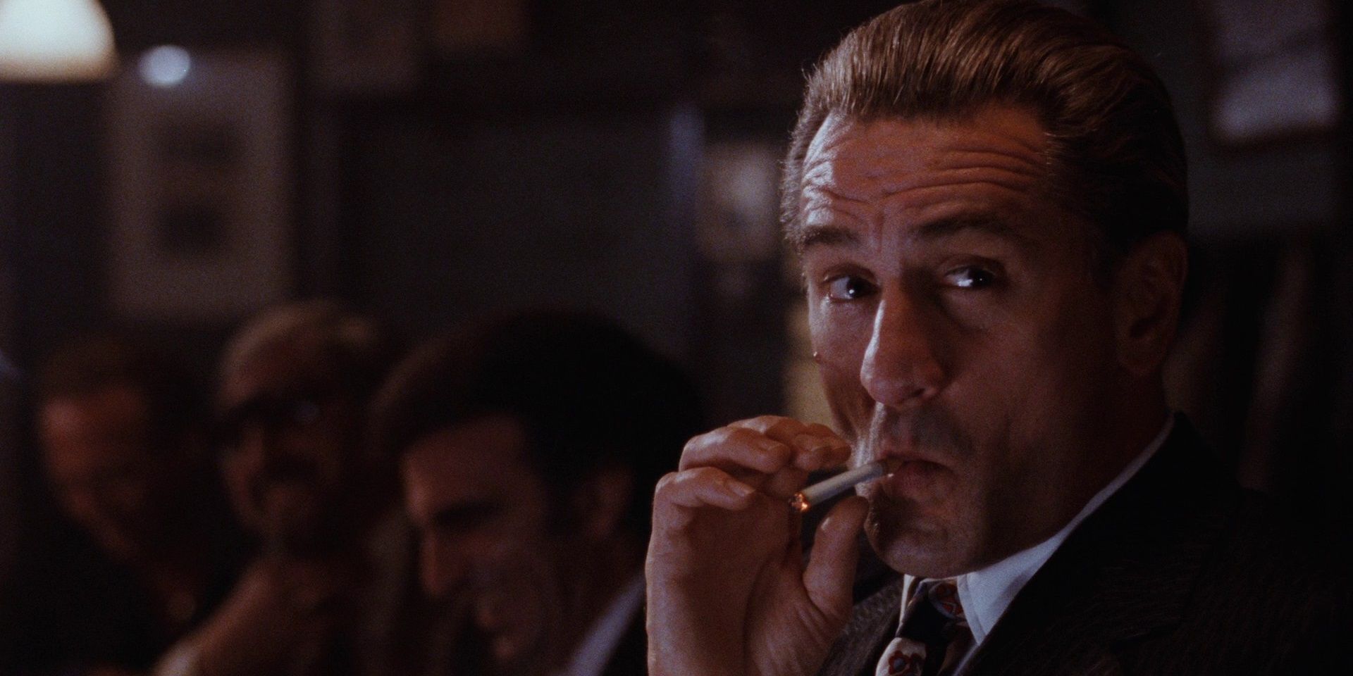 James Conway smoking a cigarette in a bar in Goodfellas