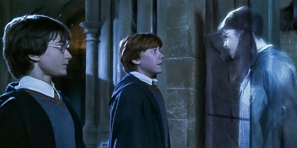 Ron and Harry look at an angry Moaning Myrtle in Chamber of Secrets