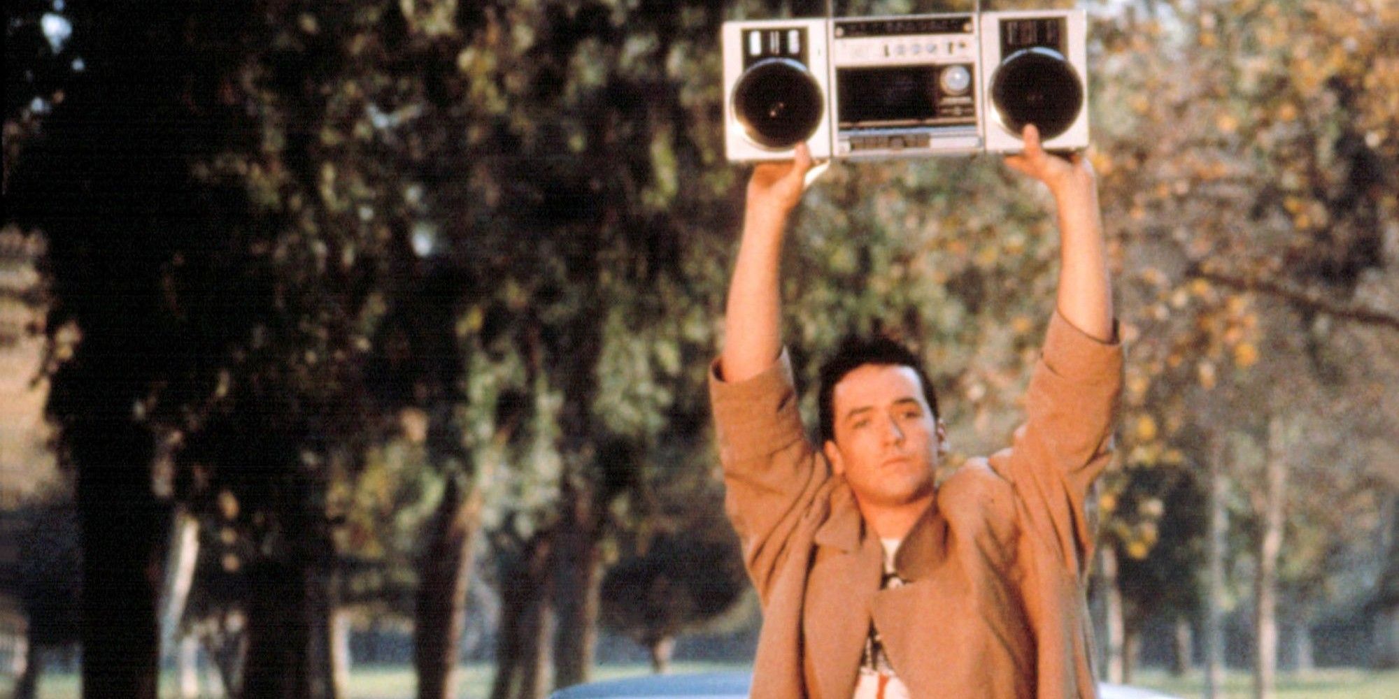 John Cusack holding a stereo over his head in Say Anything (1989)