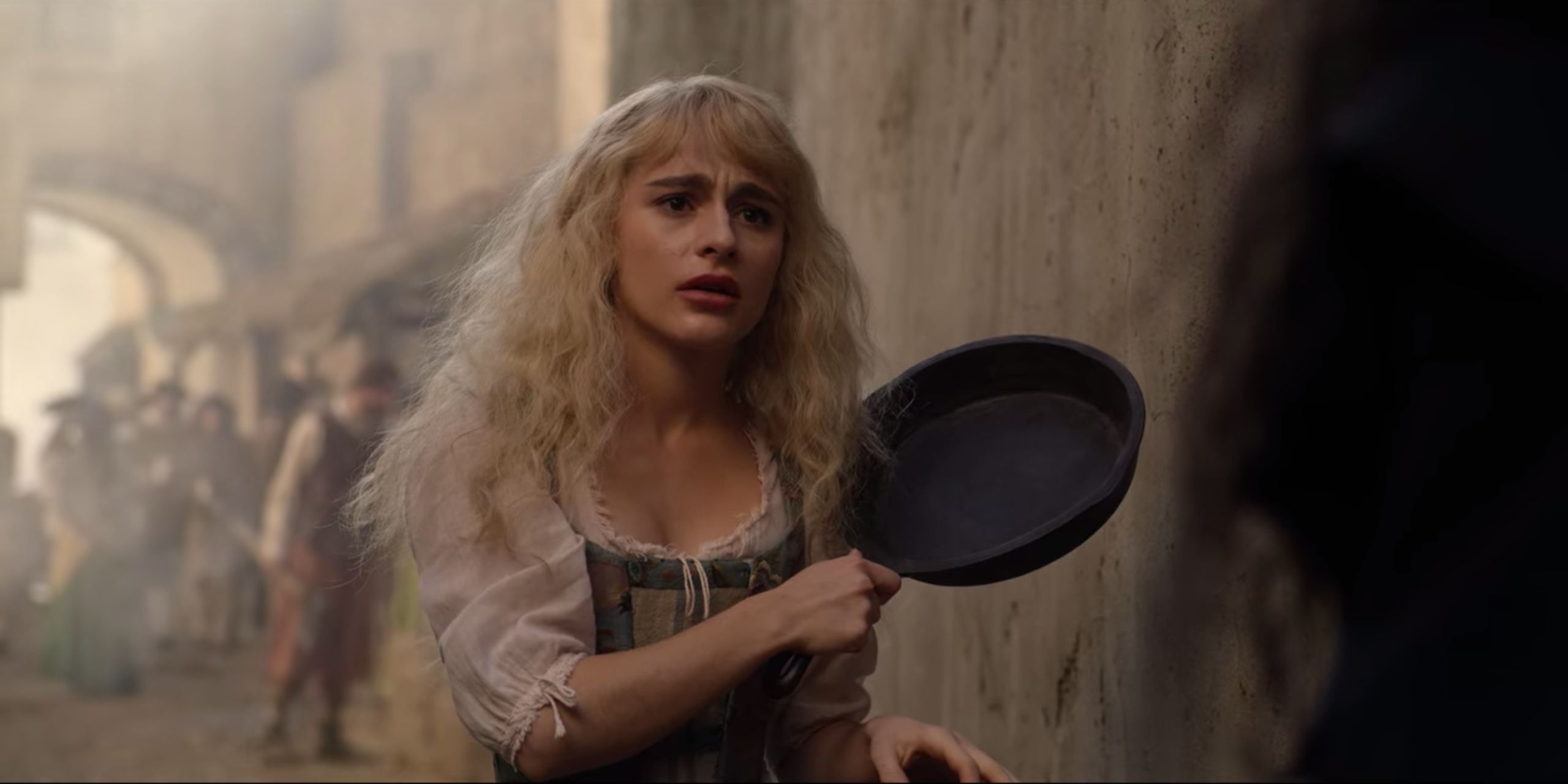 Sophie looking at Agatha, holding a frying pan, in The School for Good and Evil