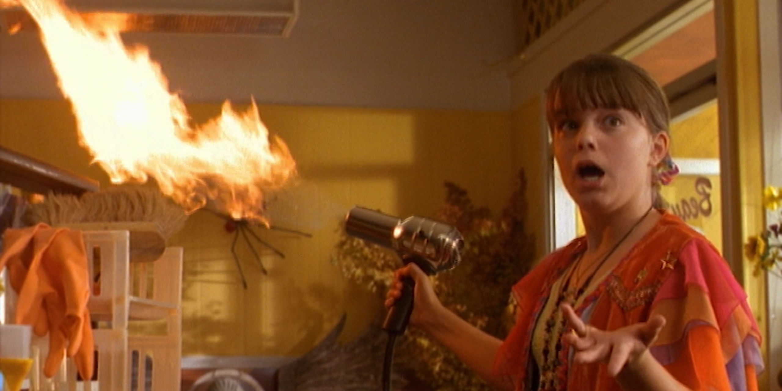 Marnie, in shock as a hairdryer shoots flames in Halloweentown