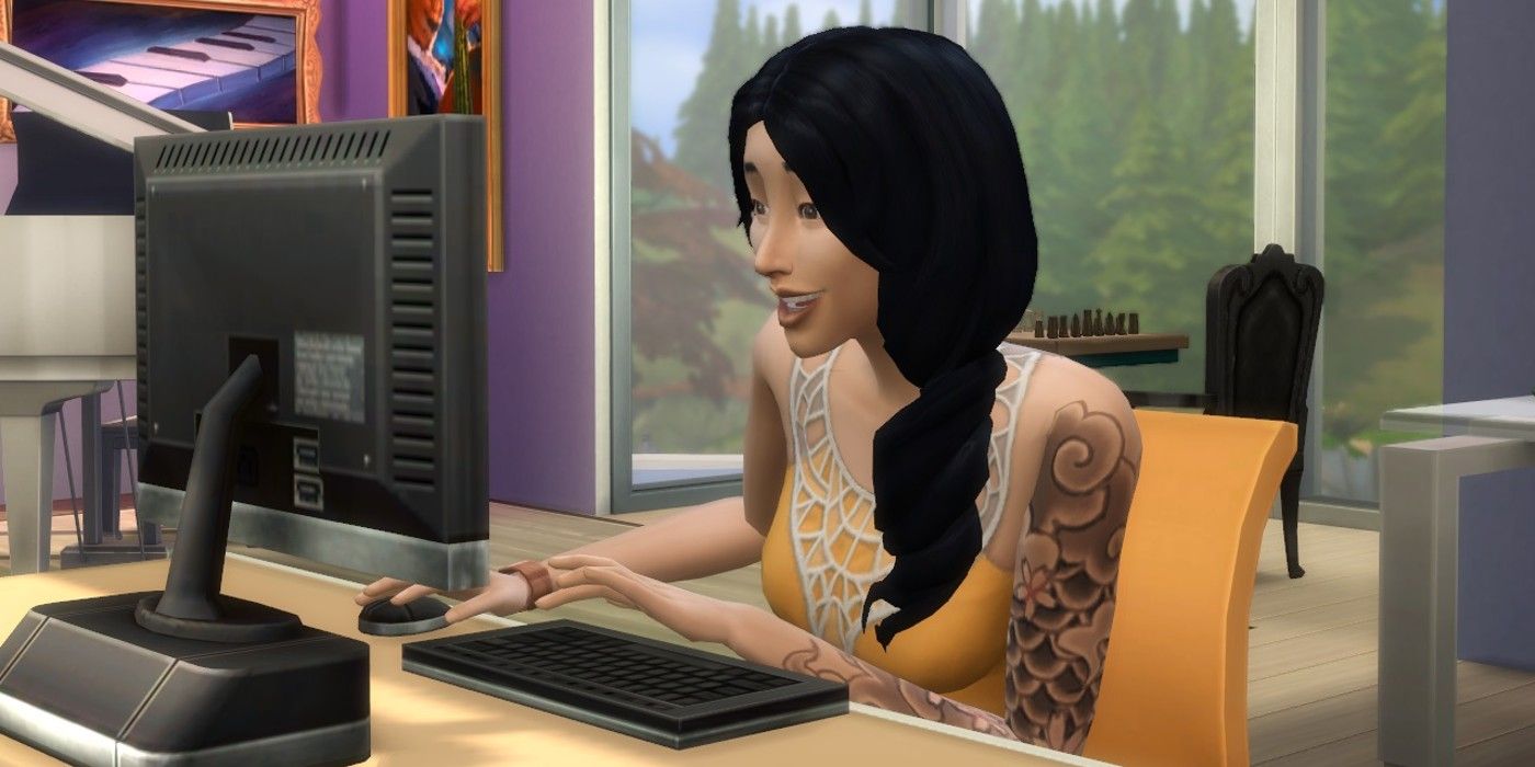 A Sims 4 Sim looking interested using a computer.