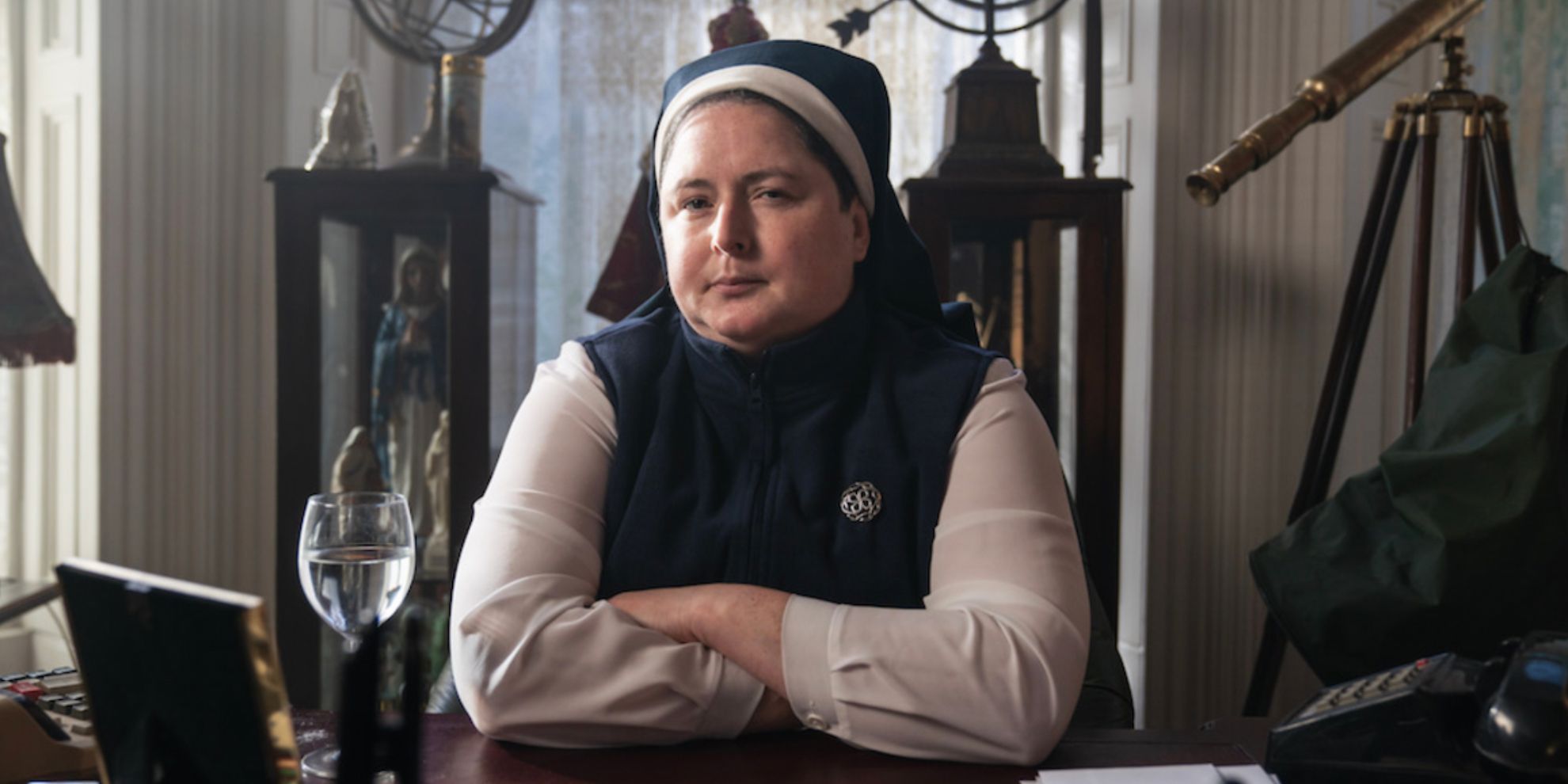 Sister Michael folds her arms in Derry Girls
