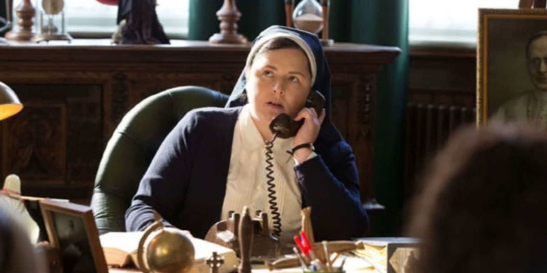 Sister Michael on the phone at her desk in Derry Girls