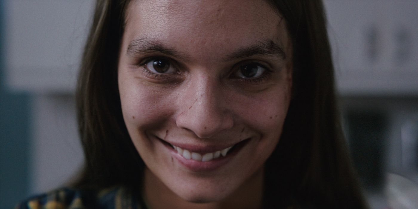 Closeup of woman smiling creepily in Smile