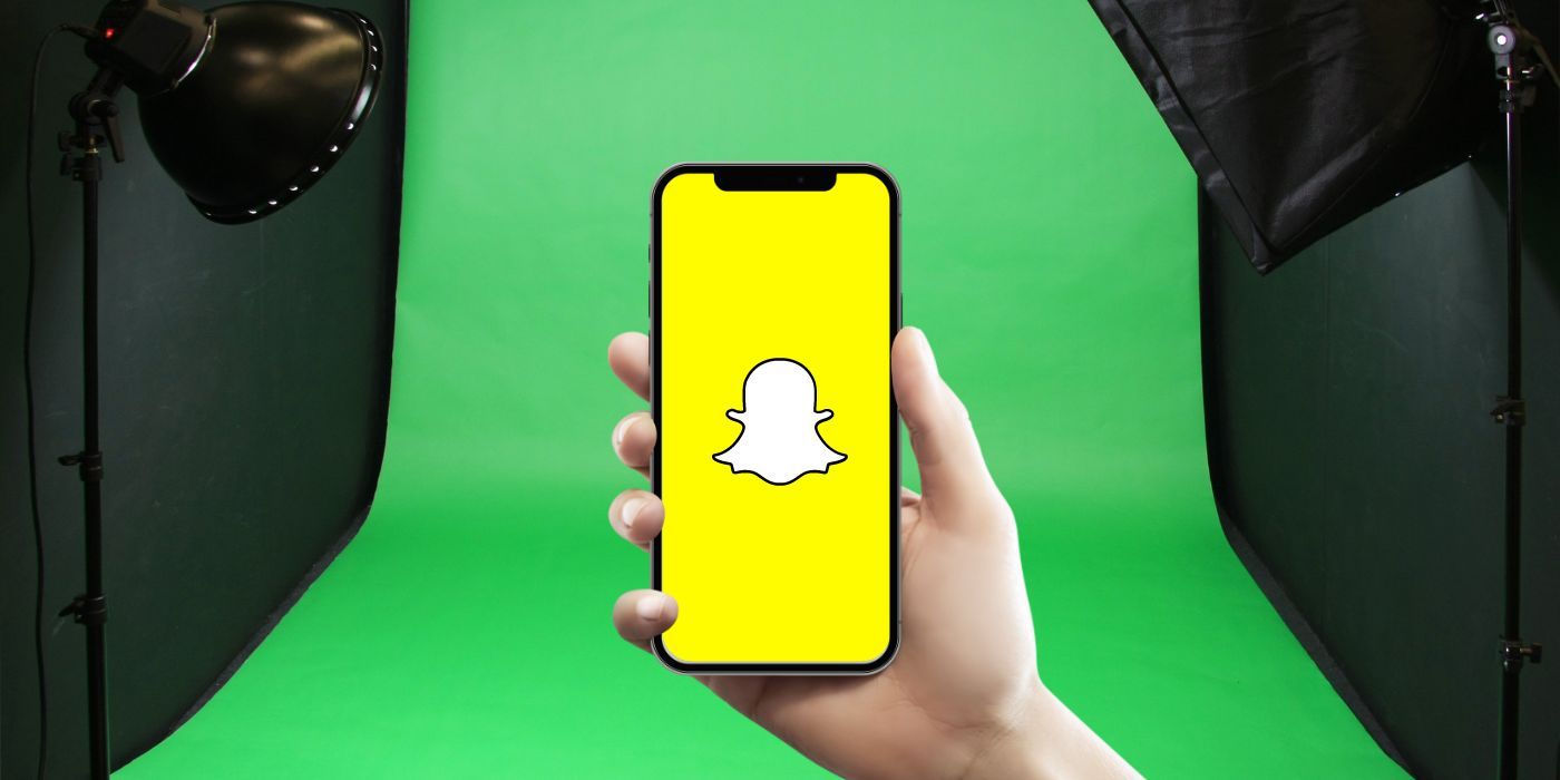 Snapchat logo on a smartphone with a green screen in the background