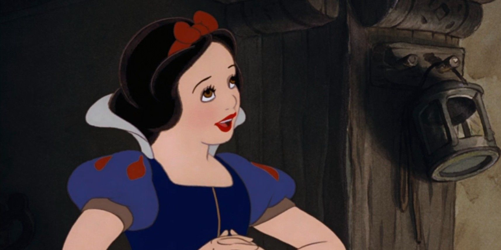 Disney's Snow White clasping hands together