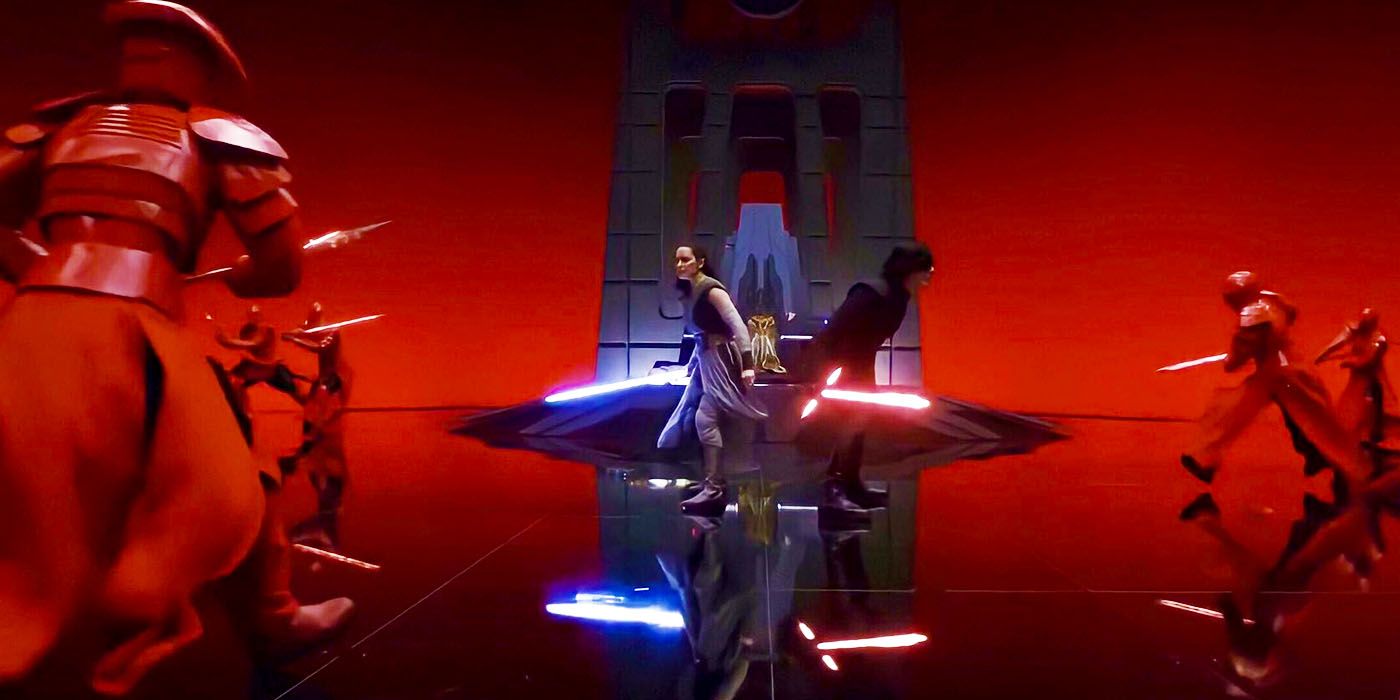 Rey and Kylo Ren back to back during the throne room lightsaber battle in Star Wars The Last Jedi