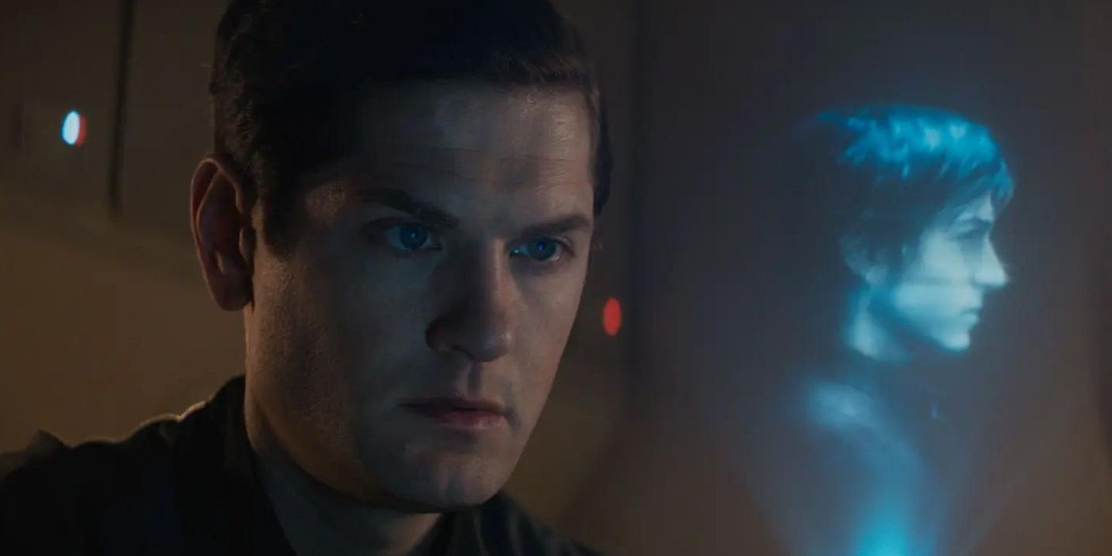 Syril Karn looking at a hologram of Cassian in Andor