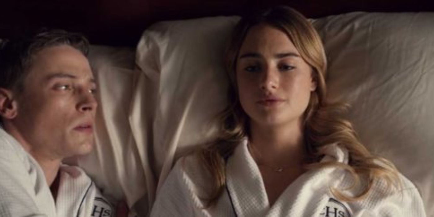 Max and Lucy lying in bed in robes in Tell Me Lies