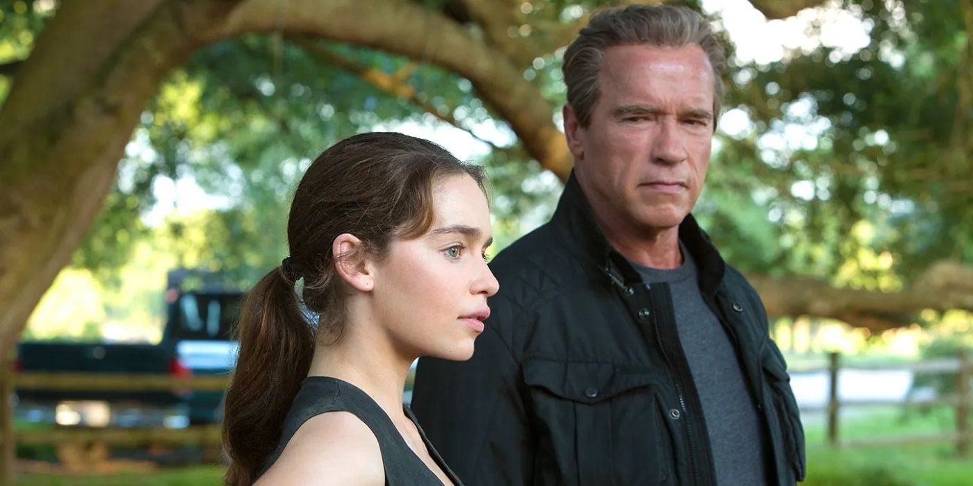 Emilia Clarke standing next to Arnold Schwarzenegger in Terminator Genisys