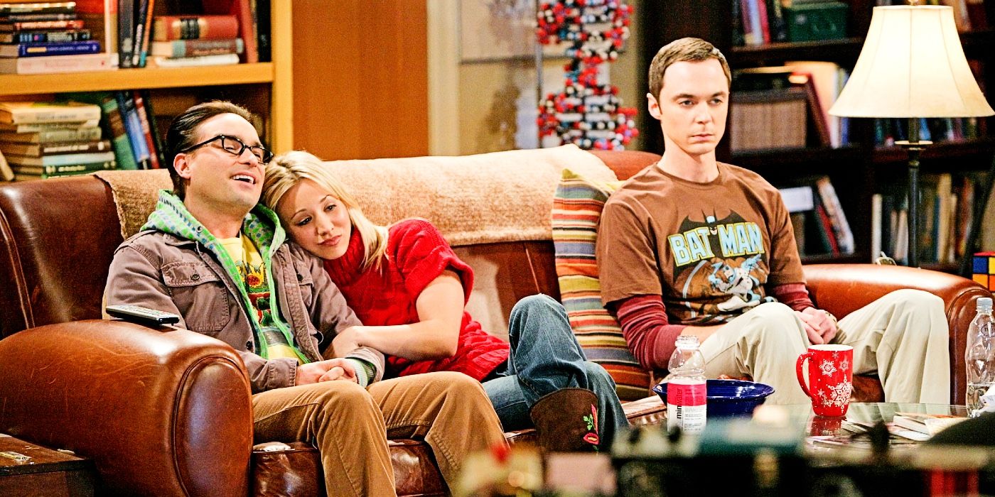 The Big Bang Theory Leonard, Penny, and Sheldon sitting on couch