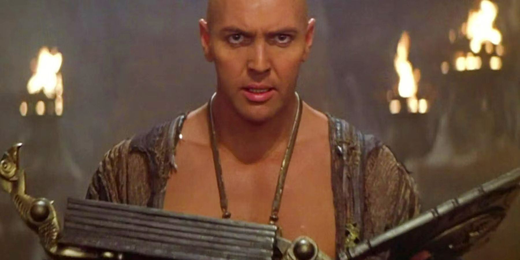Arnold Vosloo as Imhotep holding the Book of the Dead in The Mummy