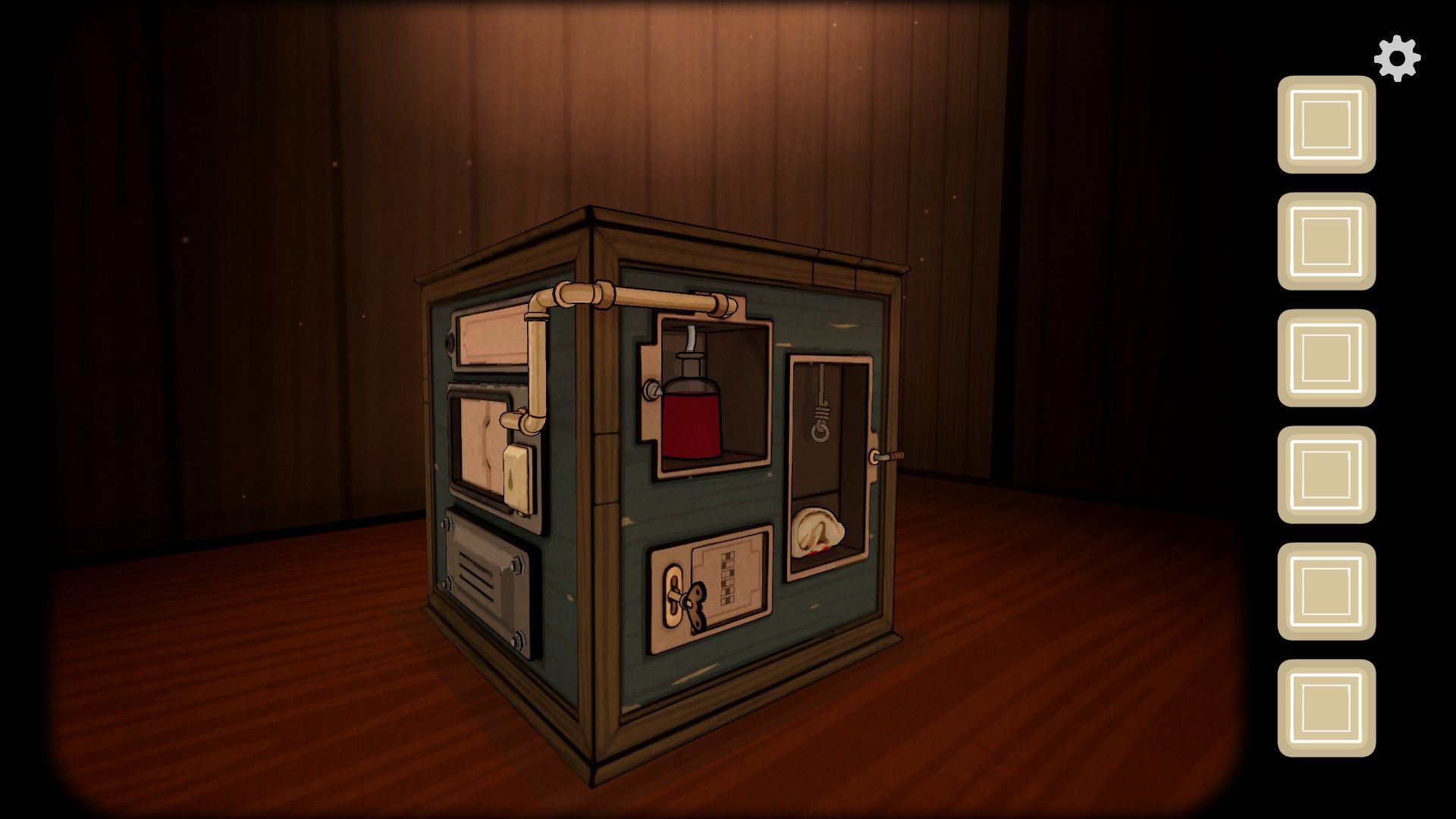 The Past Within puzzle cube showing a vial of blood, severed ear, and several compartments.