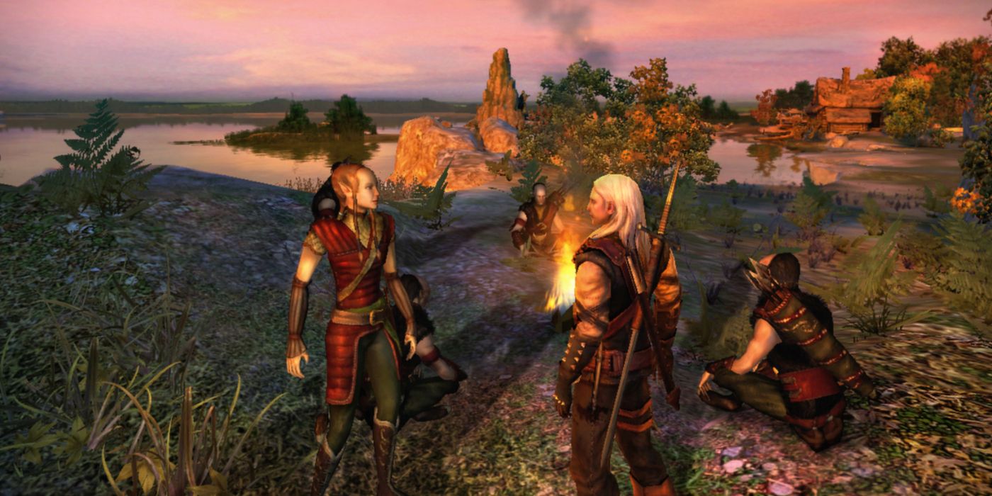 Geralt talking to a group of characters by a campfire in The Witcher.