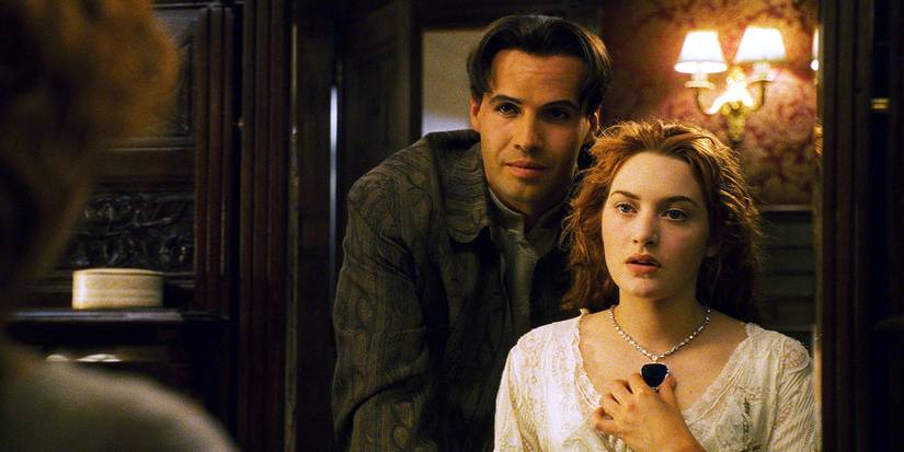 Cal (Billy Zane) giving Rose (Kate Winslet) the Heart of the Ocean in Titanic.