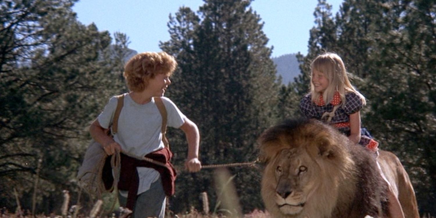 Two kids with a lion in Napoleon and Samantha