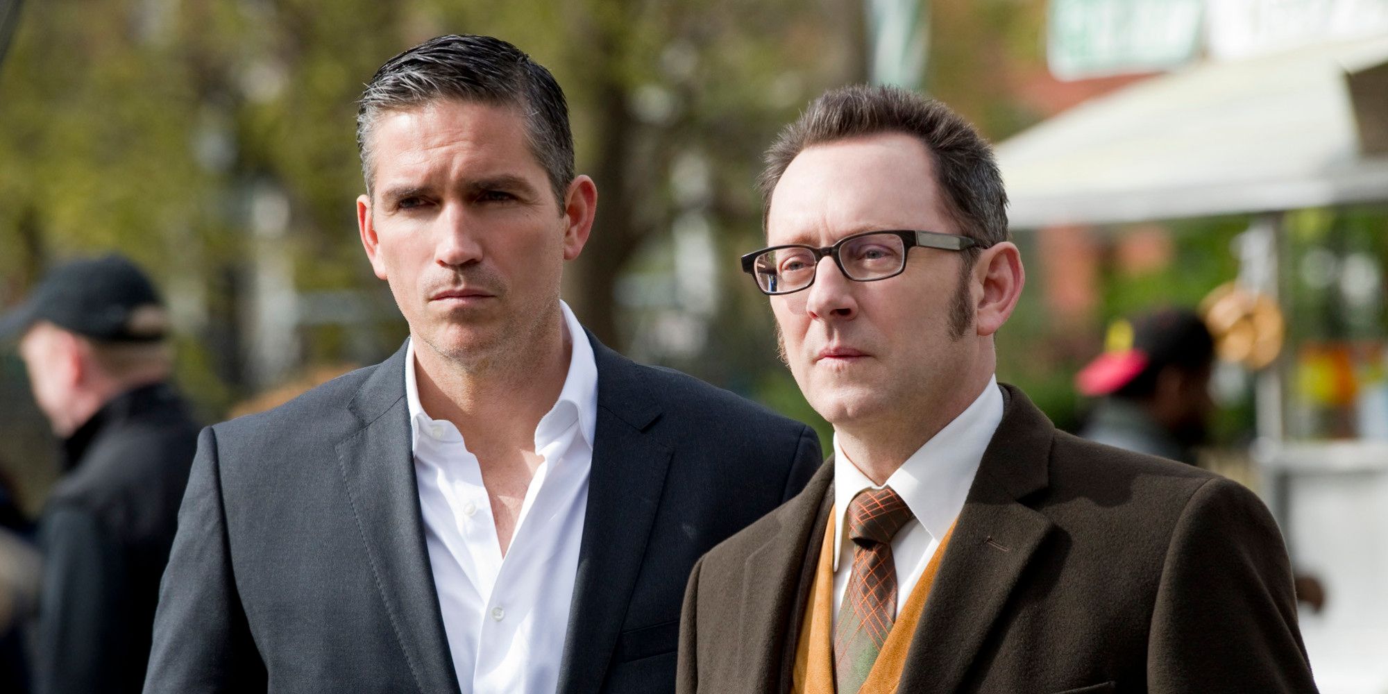 Two men dressed suits standing on the street in Person Of Interest