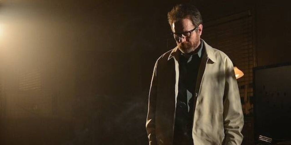 Walter White stands in a dark room in Breaking Bad