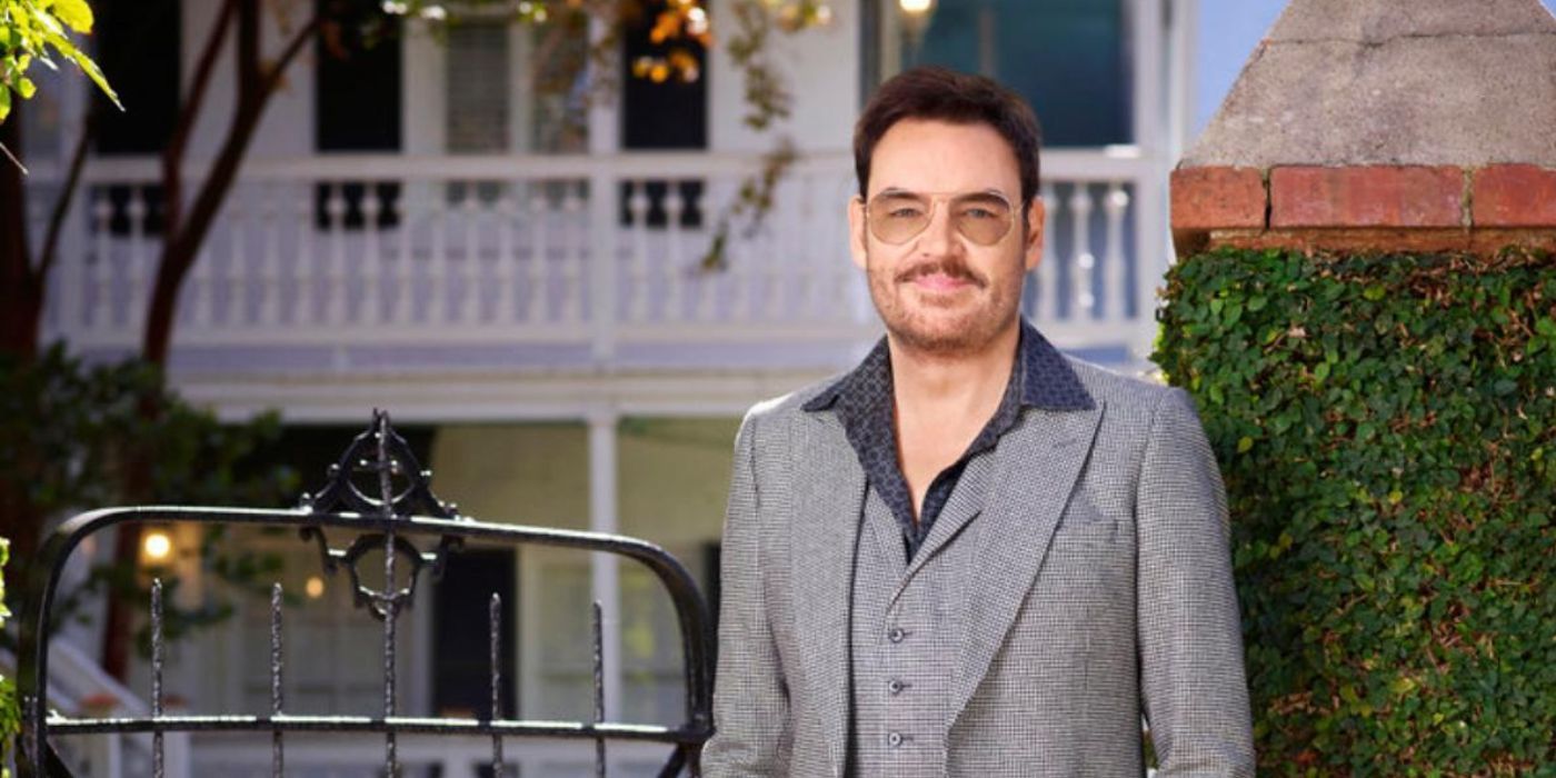 Whitney posing in front of his mom&rsquo;s house on Southern Charm