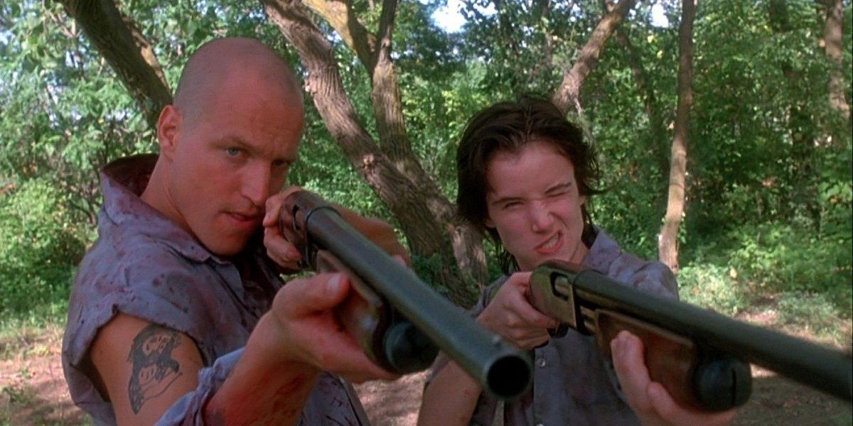 Woody Harrelson and Juliette Lewis with shotguns in Natural Born Killers