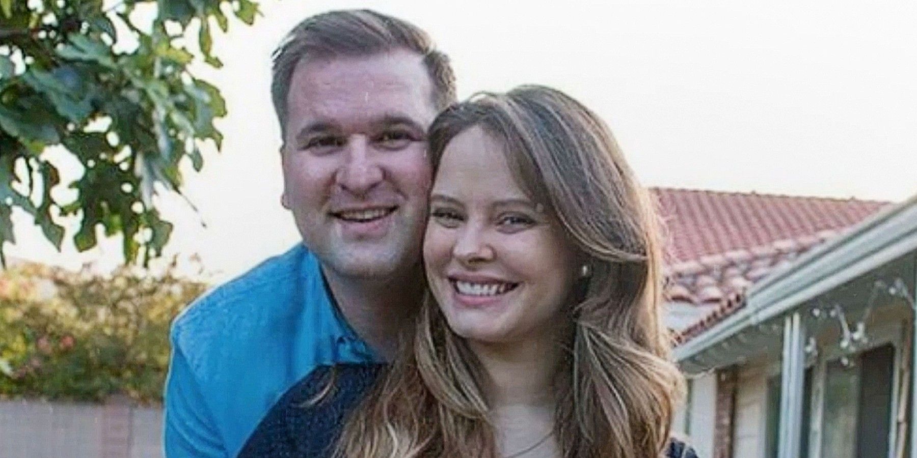 Alan and Kirlyam Cox from 90 Day Fiance embracing each other and smiling