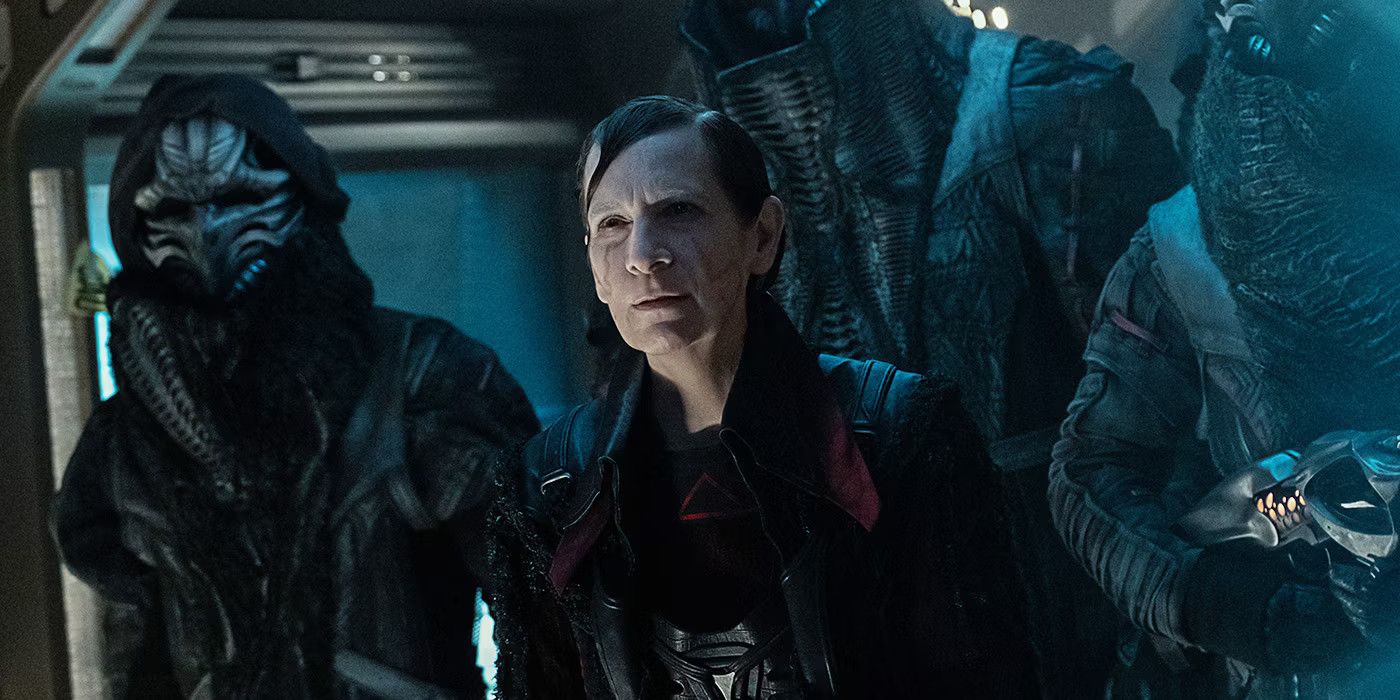 Amanda Plummer as Vadic in Star Trek Picard season 3 looking sinister surrounded by hulking masked goons with weapons