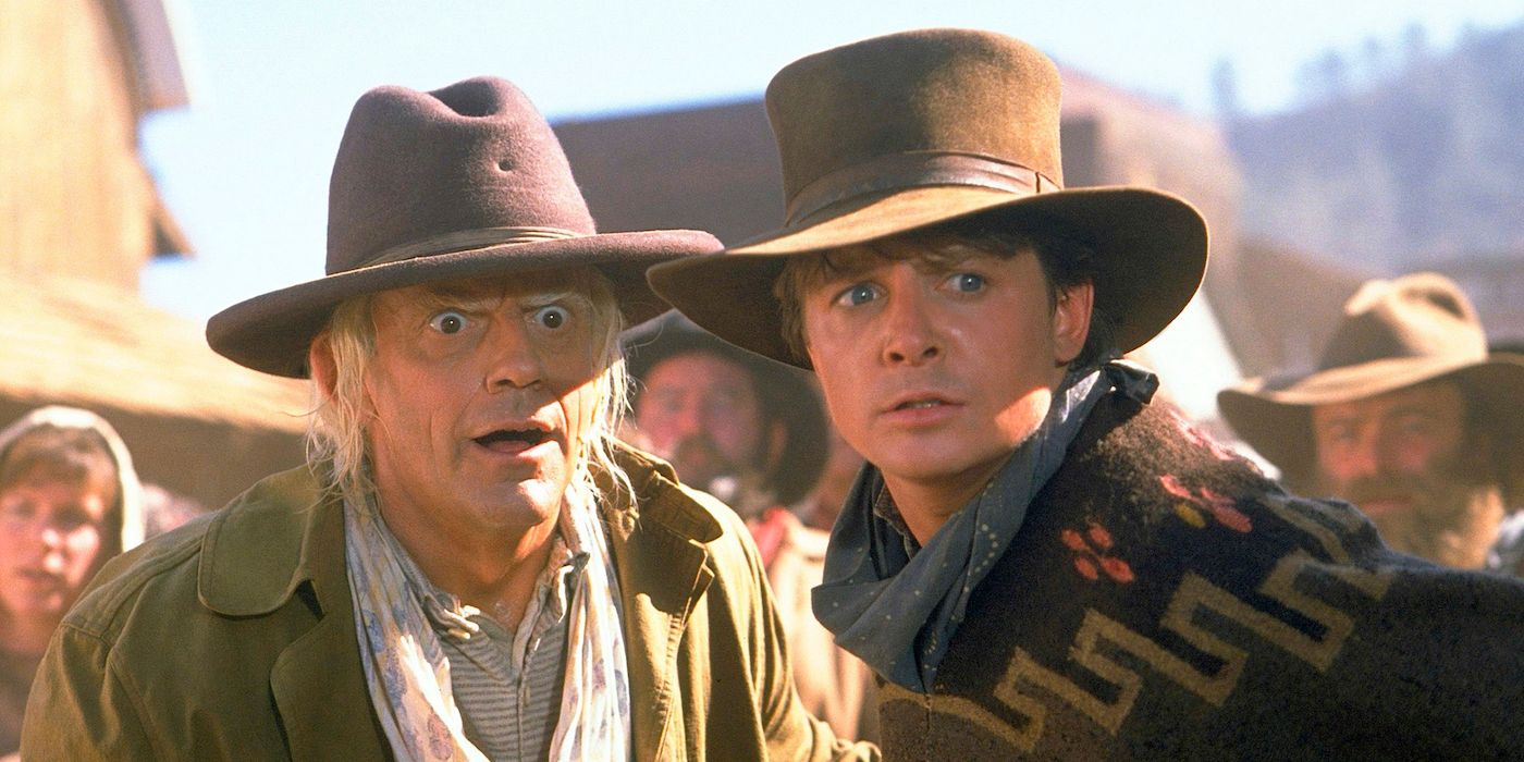 Marty McFly and Doc Brown in Cowboy Hats Looking Bewildered in Back to the Future 3
