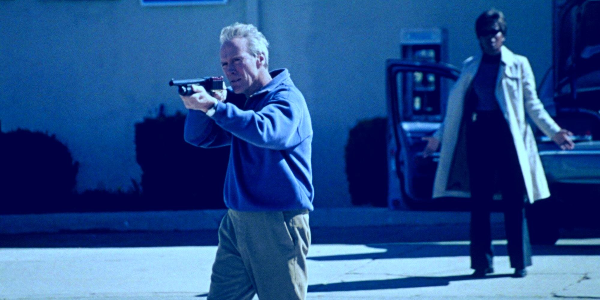 Clint Eastwood as McCaleb shooting a shotgun in Blood Work