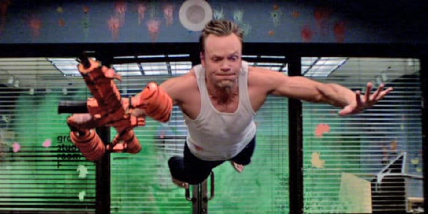 Joel McHale jumping from a paintball explosion in Community