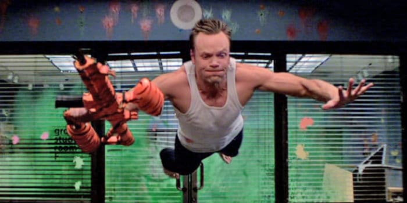 Joel McHale jumping from a paintball explosion in Community 