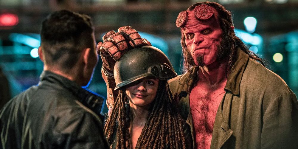 Hellboy touches a woman's helmet in Hellboy