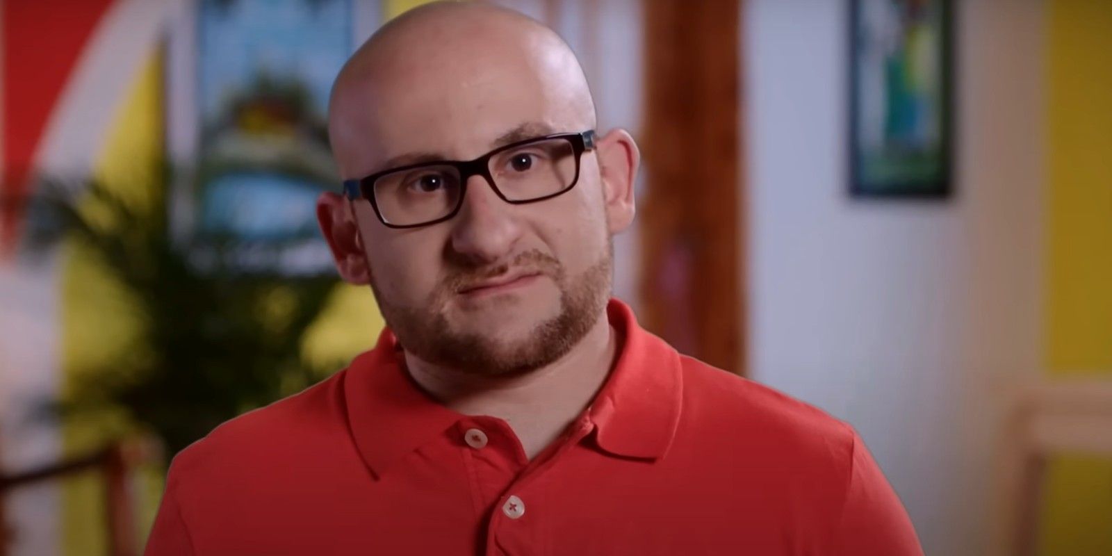 Mike Berk wearing a red shirt in 90 Day Fiancé 