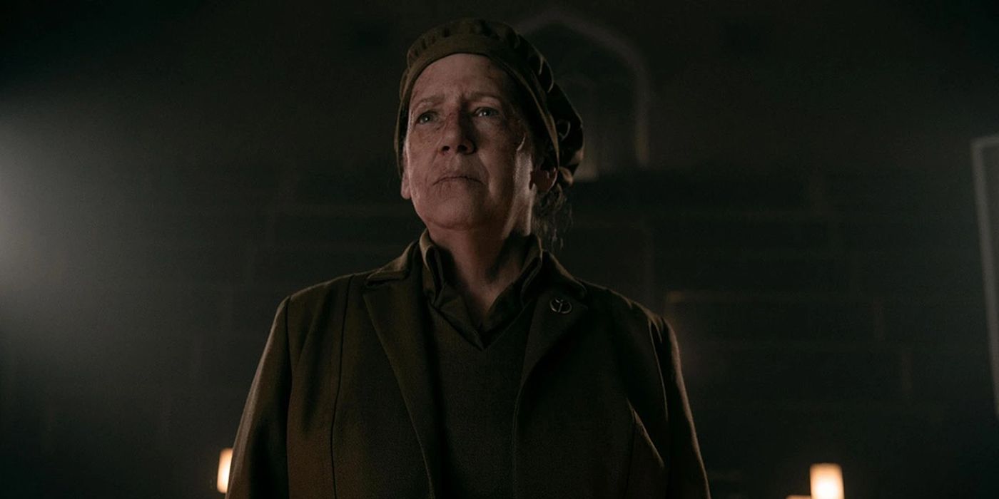 Aunt Lydia standing in the dark in The Handmaid's Tale