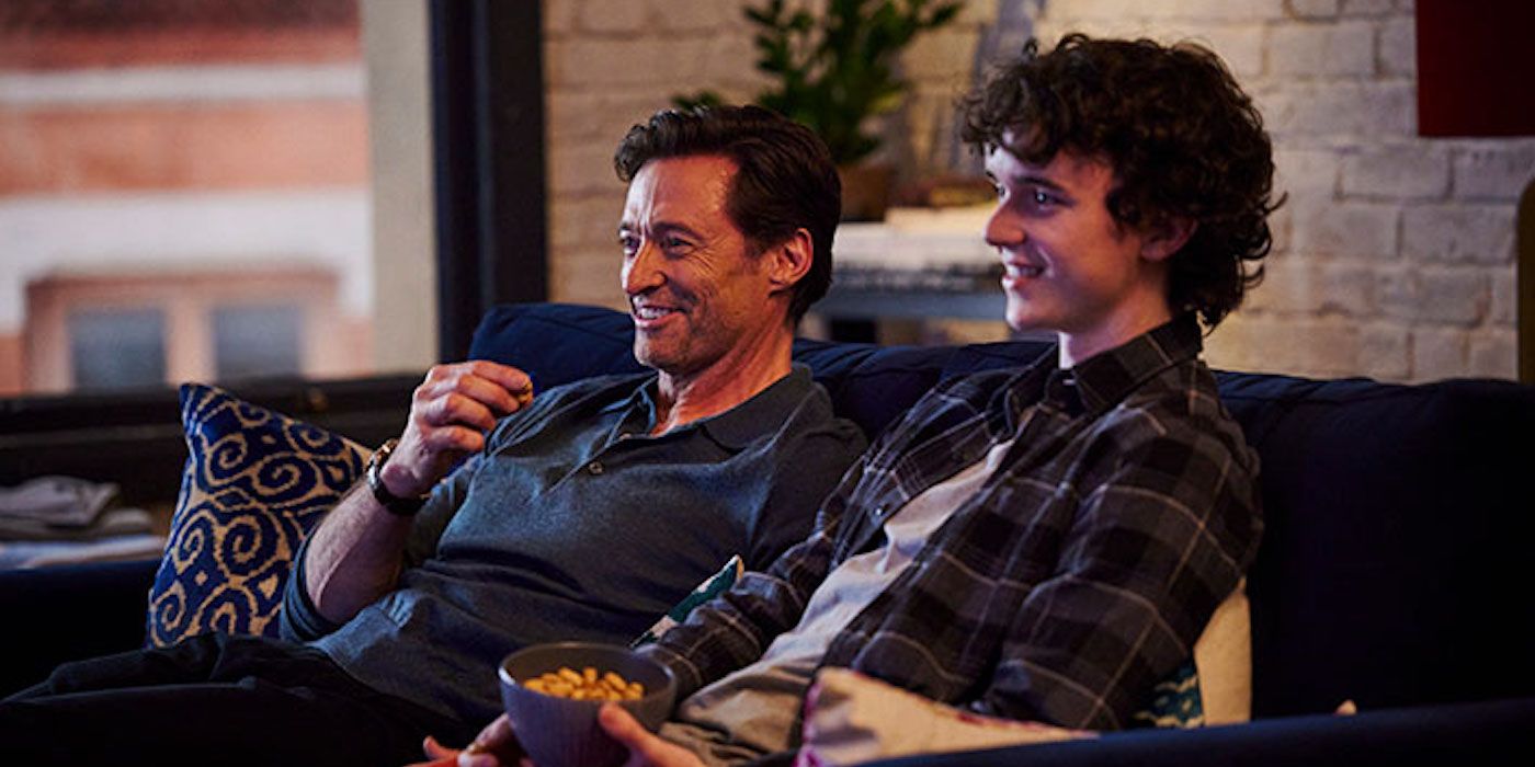 Hugh Jackman laughing on the couch in The Son