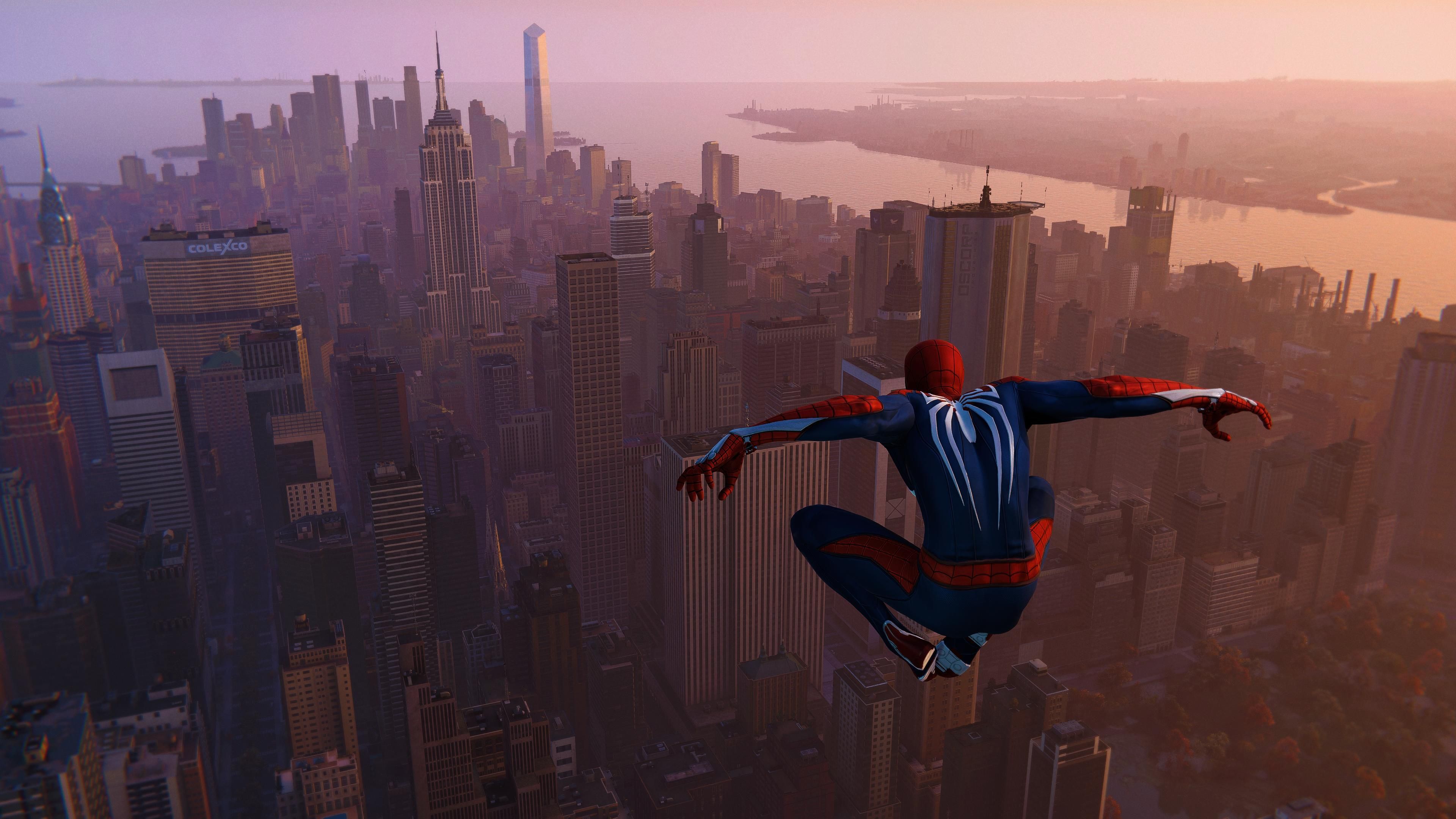 Spider-Man jumping high above the open-world Manhattan map in Marvel's Spider-Man