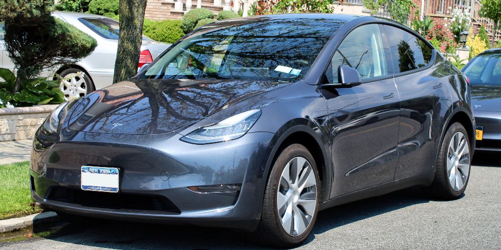 A gray Tesla Model Y is seen parked on the street