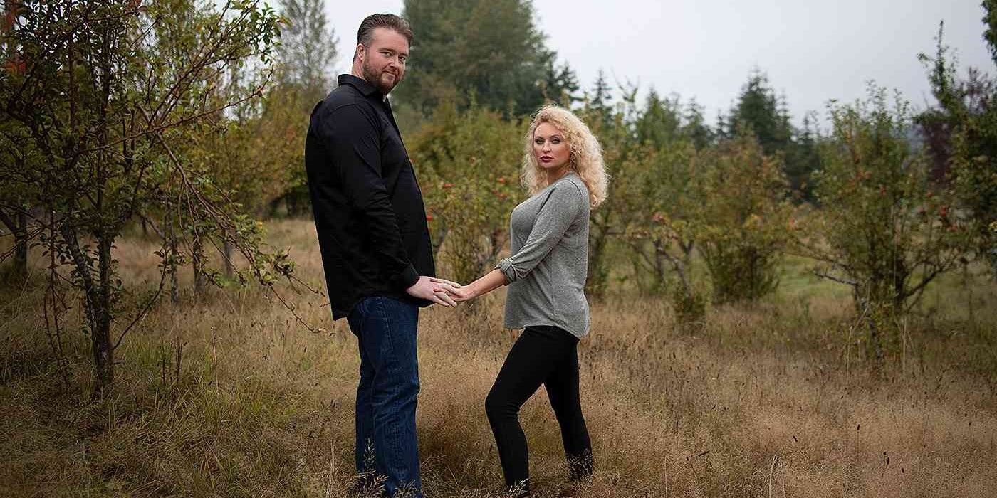 Mike Youngquist and Natalie Mordovtseva on 90 Day Fiancé Promo Shot holding hands outdoors