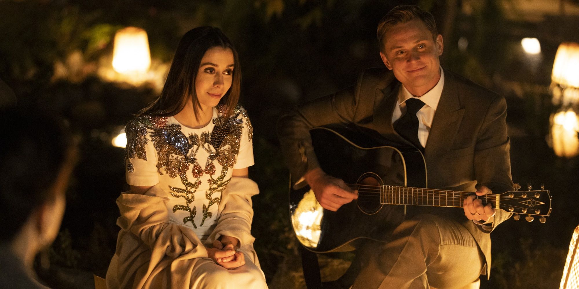 A man and woman play the guitar in Made For Love 