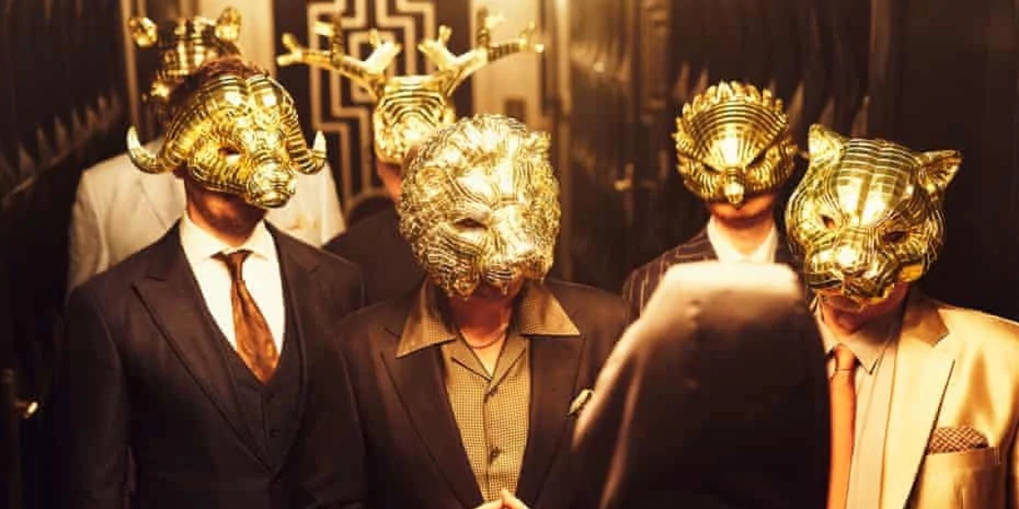 A still of the VIPs from Squid Game (2021)