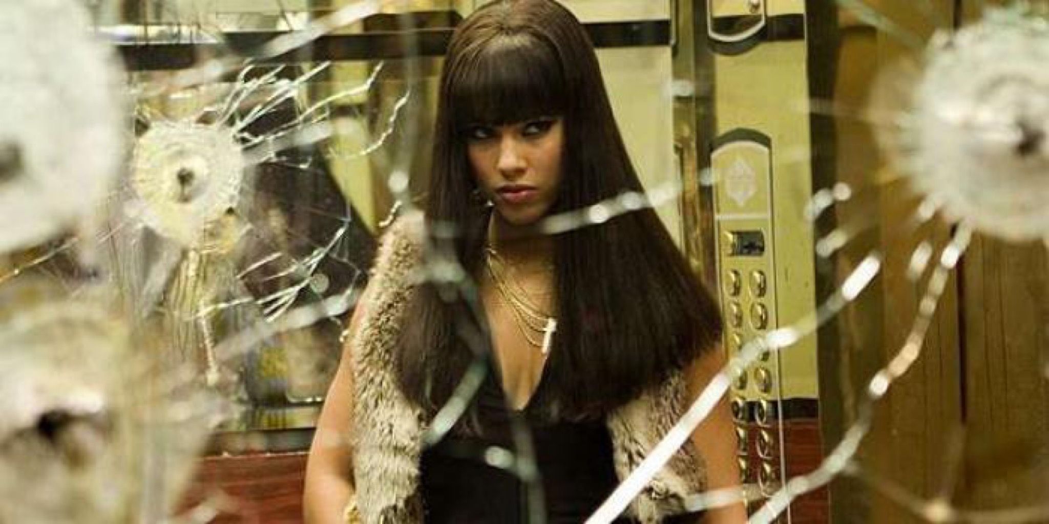 Alicia Keys looking at a bullet-riddled mirror in Smokin’ Aces (2006)